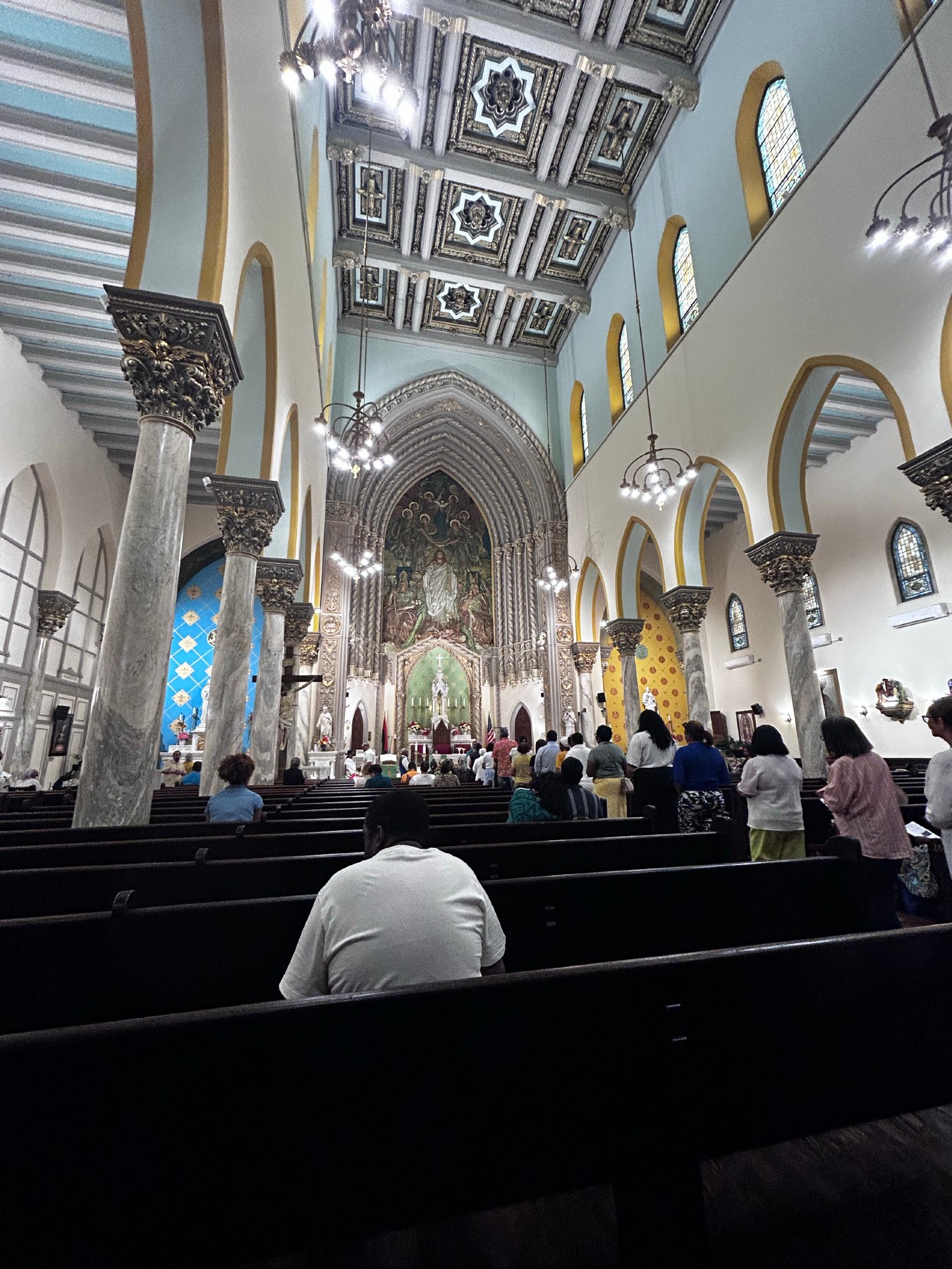 Congregants standing during worship